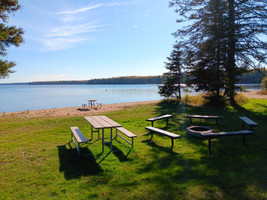 Picnic tables and firepit at the Narrows beach