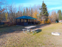 Covered picnic areas, benches, and fire pits.