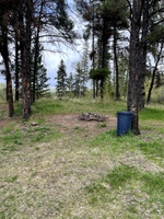 Garbage can and fire pit at the boat launch