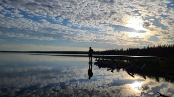 I was walking along the beach when I looked up to see my husband had stepped onto a rock. I had to capture the reflection. 