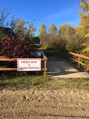 Paddle boat and canoe rentals sign.
