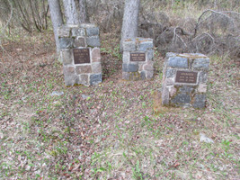 Grave markers for Grey Owl, Anahereo, and their daughter Shirley Dawn.