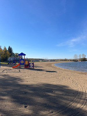 Sandy beach and playground.