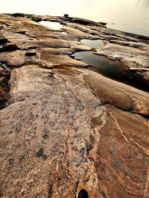 Rocky shoreline of one of the islands in Jan