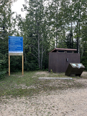 Outhouse and garbage cans.