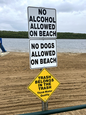 Beach rules sign.