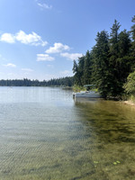 Boats pulled up on shore near launch