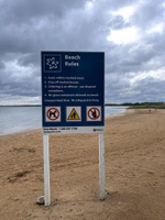Beach rules sign.