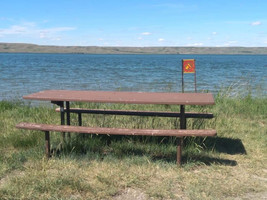 Picnic table near the water at Cypress Lake Recreation Site