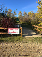 Paddle boat and canoe rentals sign.