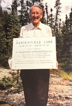 William Pasterfield's brother with the plaque at the lake.