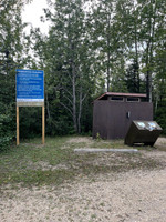 Outhouse and garbage cans.