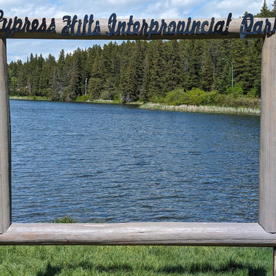 Visitor sign with lake in background