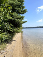 Little beach just down from the boat launch accessible by water.