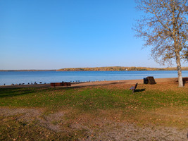 Benches, and garbage cans at the beach.