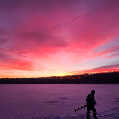 Winter ice fishing and camping on the lake 