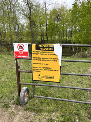 Signage at the entrance to the private road that leads to the lake.