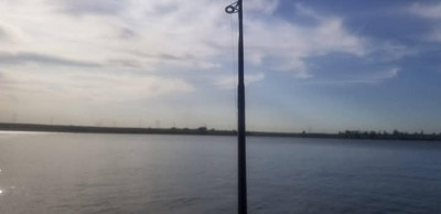 Fishing off to the side of the dam-Woodlawn Regional Park