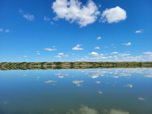 Like "glass".  This salty mineral rich lake looks like this for many days in summer plus evening sunsets paddling on the lake.  You won't catch any fish here but landscape photography is epic. (no filter)