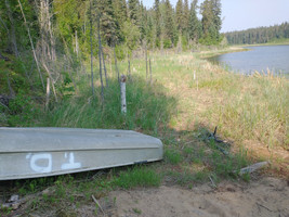 Boat left on the shore of the lake