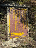 Pond sign that has fallen over.