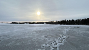 Wet and slushy, footprints to the fish.