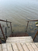 Steps down from the dock.