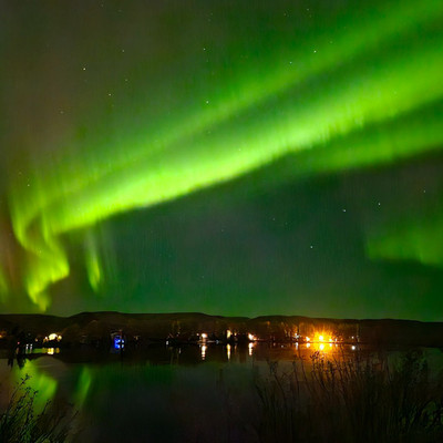 Northern Lights reflecting in the lake @saskstormchaser 