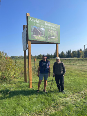 Omar Aschim who grew up at the Aschim Homestead and his son Kevin.
